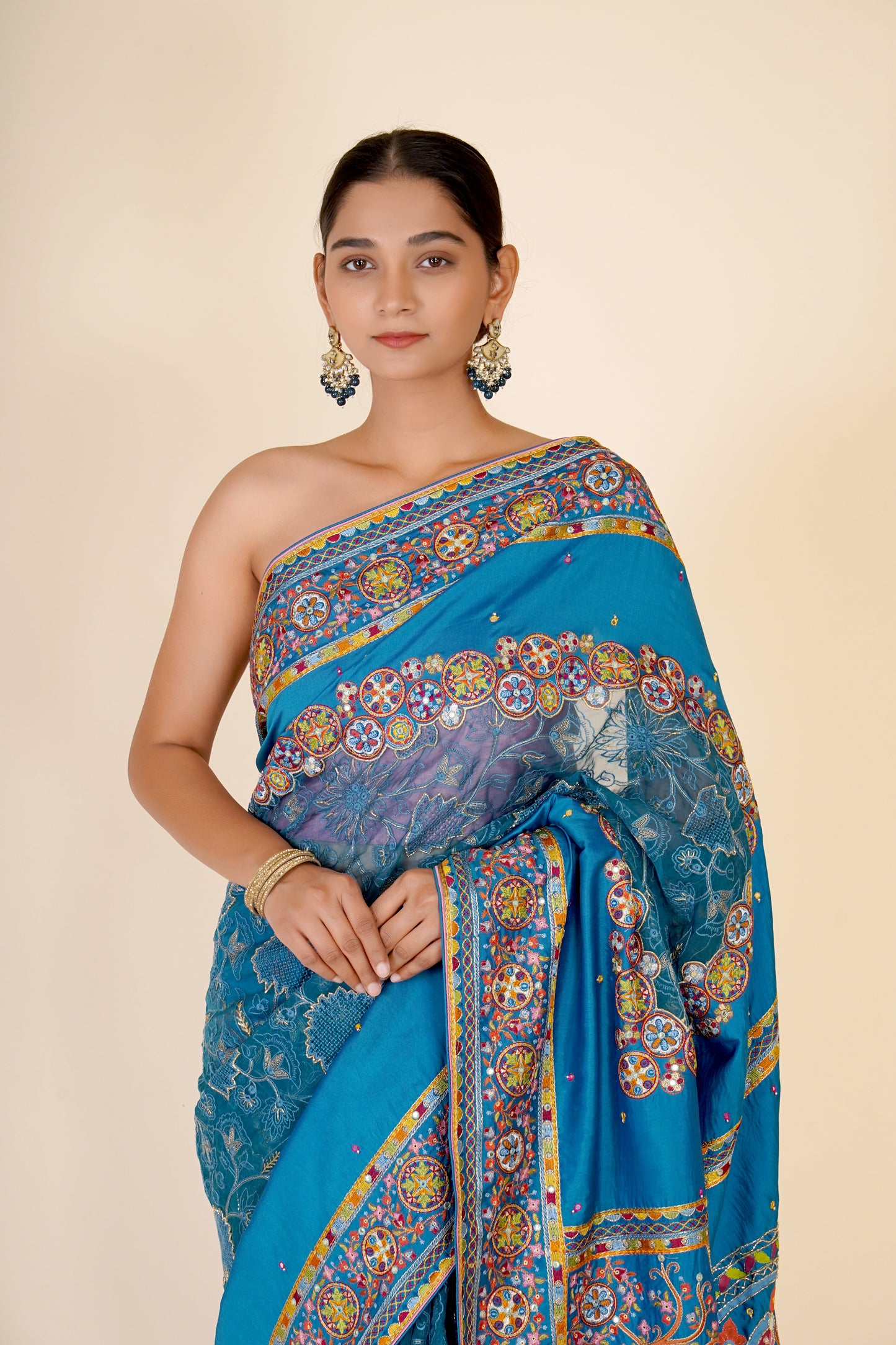 TURQUOISE BLUE ORGANZA AND DOLA SILK SAREE